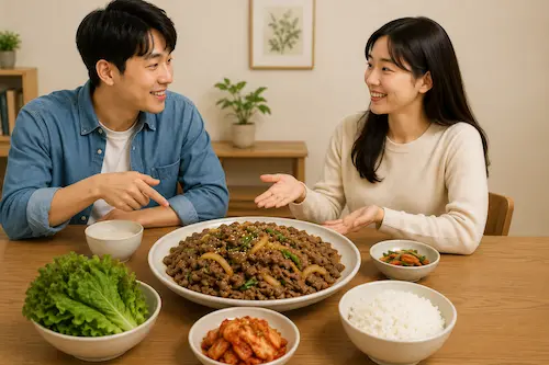 Two people smiling and practicing basic Korean questions together