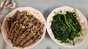 Korean steamed beef rolls with vegetables served with dipping sauce